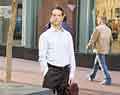 Man with leather briefcase.